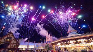 Colorful fireworks fill the sky over Fantasyland and Cinderella Castle at the Magic Kingdom during the Happily Ever After nighttime show.
