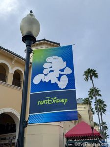 A white silhouette of Minnie Mouse running is seen on a blue runDisney sign hanging on a light post at the ESPN Wide World of Sports Complex at Walt Disney World.