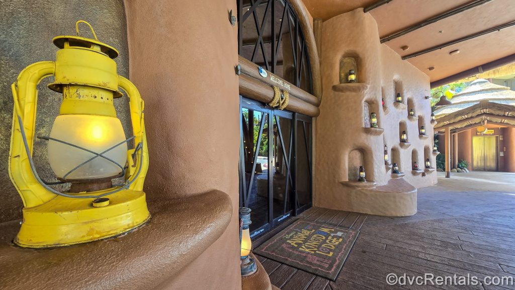Multicolored lanterns sit on small shelves on display outside the entryway to Disney’s Animal Kingdom Villas Kidani Village.