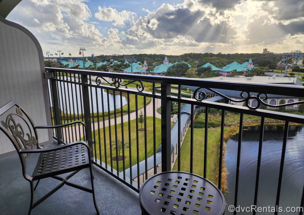 The view from a balcony at Disney’s Riviera Resort. On the balcony is a metal chair with the resort’s “RR” logo included in the back of the design, as well as hidden Mickeys that can be spotted in the railing.