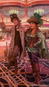The Disney Destiny’s storyteller character duo Zayah and Gamble pose in their pirate night outfits in the ship’s Grand Hall.