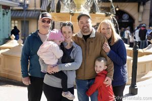 Guest blogger Christie Hecht and her family pose outside the France pavilion at EPCOT.