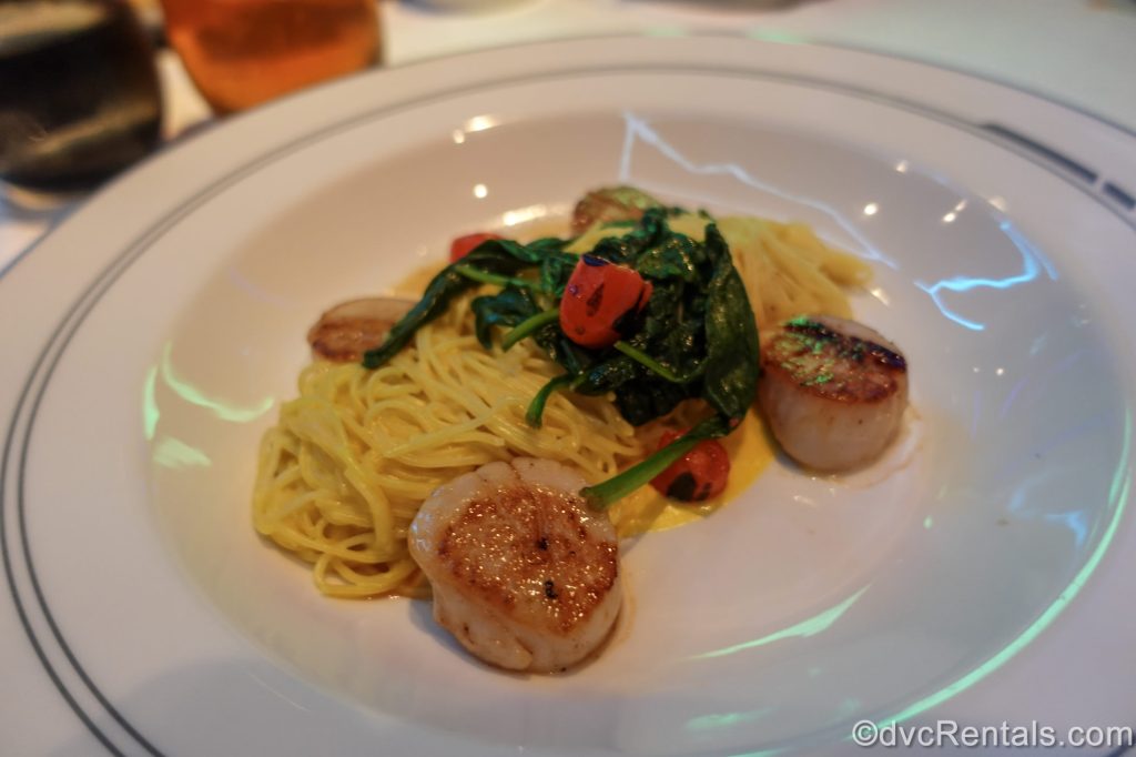 The Golden Mystic Pasta is served in a white dish in the Worlds of Marvel dining room aboard the Disney Destiny.