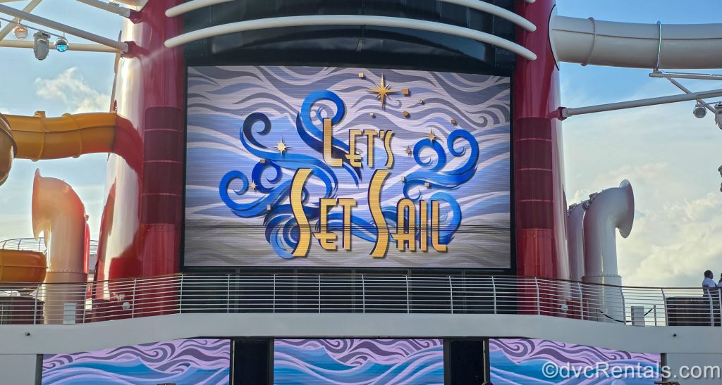 The Funnel screen of the Disney Destiny displays the words “Let’s Set Sail” in yellow writing with blue wave-inspired accents.