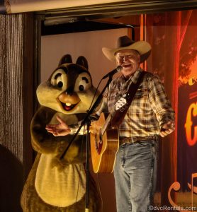 The cowboy campfire singer and Chip perform during Chip ‘n’ Dale’s Campfire Sing-A-Long at Disney’s Fort Wilderness Resort.