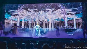 Elsa, Anna, and other characters inspired by the Frozen films perform on stage during the First Time in Forever: A Frozen Sing-Along Celebration show.