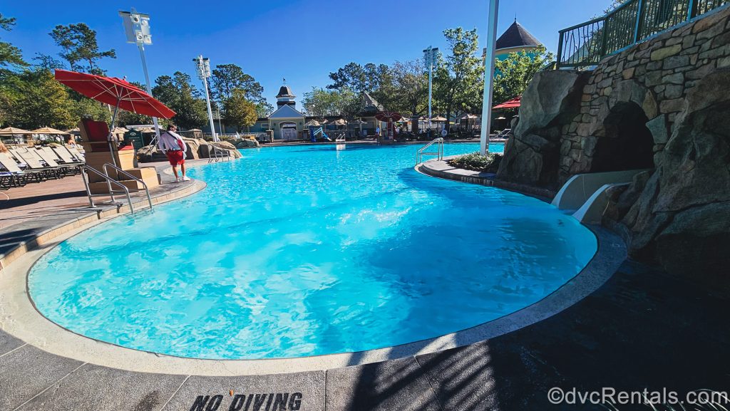 The High Rock Springs pool and waterslide entry are seen at Disney’s Saratoga Springs Resort & Spa under a bright sunny sky.