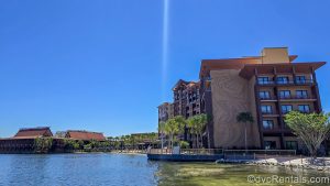 he new Island Tower stands to the right of the Longhouses at Disney’s Polynesian Villas & Bungalows while the waters of the Seven Seas Lagoon shimmer in the sun.