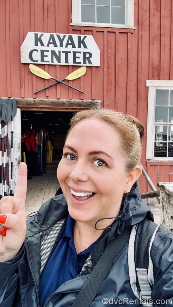 David’s Vacation Club Rentals team member Stacy R. poses for a selfie in front of the Kayak Center in Icy Strait Point, Alaska.