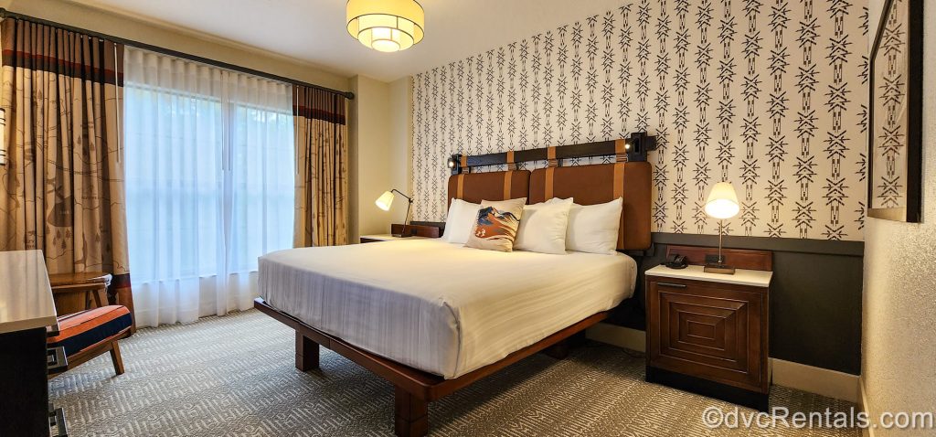 he king bed is seen in the One Bedroom Villa at the Boulder Ridge Villas at Disney’s Wilderness Lodge. The room is decorated with prints and artwork inspired by the frontier age and natural beauty of the wilderness.