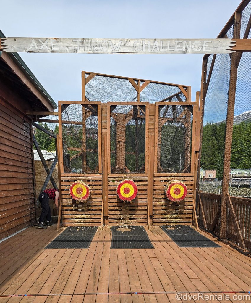 Red and yellow bullseye targets are lined up for the axe-throwing challenge excursion in Ketchikan, Alaska.