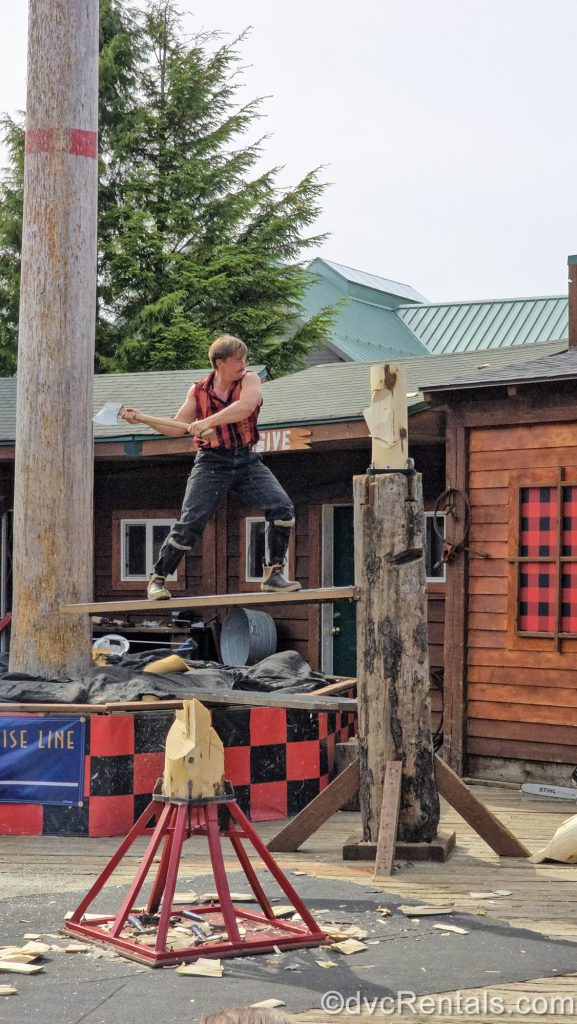 A sportsman swings his axe at a log during a competition as part of the Great Alaskan Lumberjack Show Disney Cruise Line excursion in Ketchikan, Alaska.