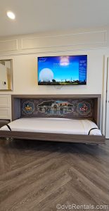 The pull-down bunk-style bed is pulled down in a Studio at Disney’s BoardWalk Villas, revealing the Mickey and Minnie-themed artwork and mattress.