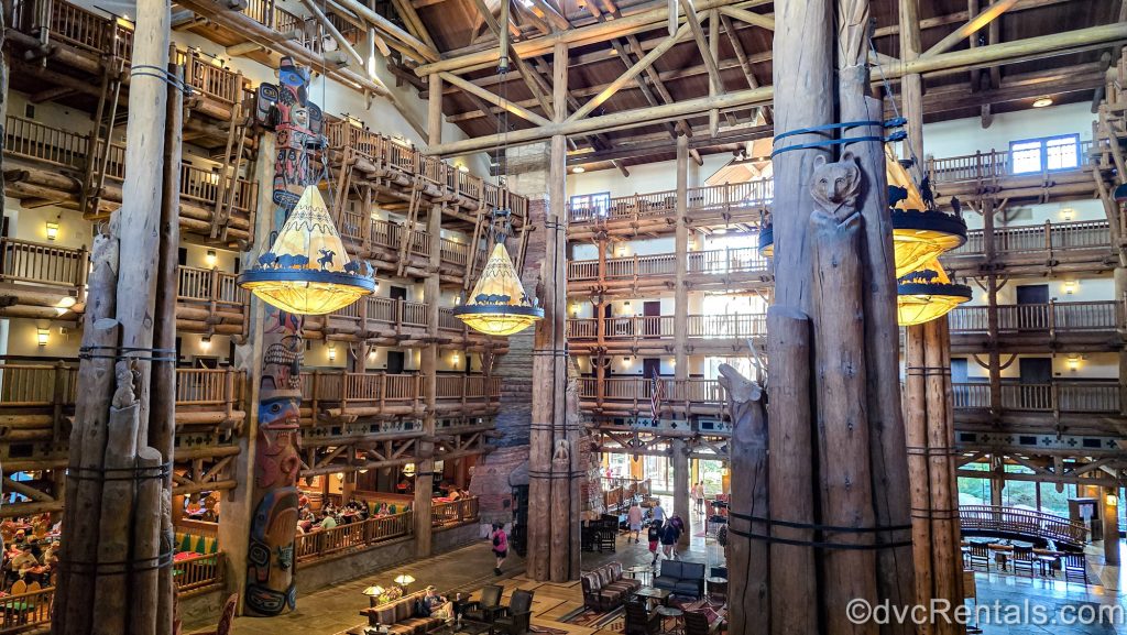 The log-cabin inspired interior of the main lobby at Disney’s Wilderness Lodge. The space is decorated with wilderness-inspired art and artifacts from the Pacific Northwest.