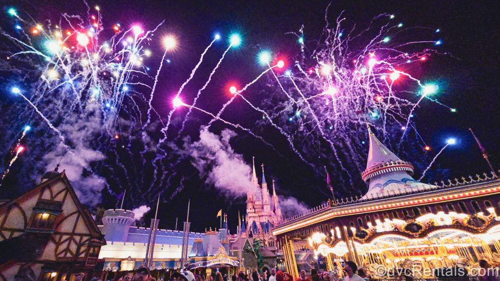 Multicolored fireworks fill the sky over Fantasyland and Cinderella Castle at Magic Kingdom.